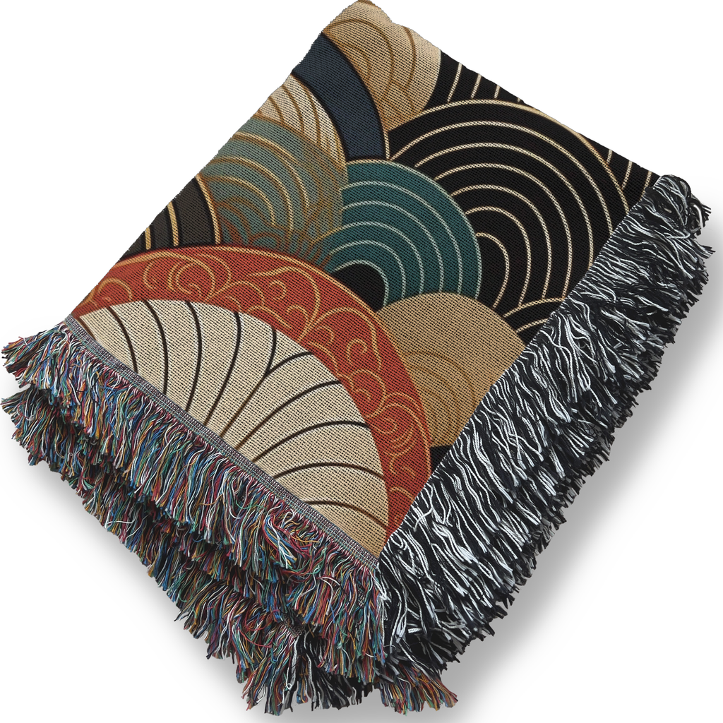 Decorative throw blanket with geometric pattern and fringes on a white background