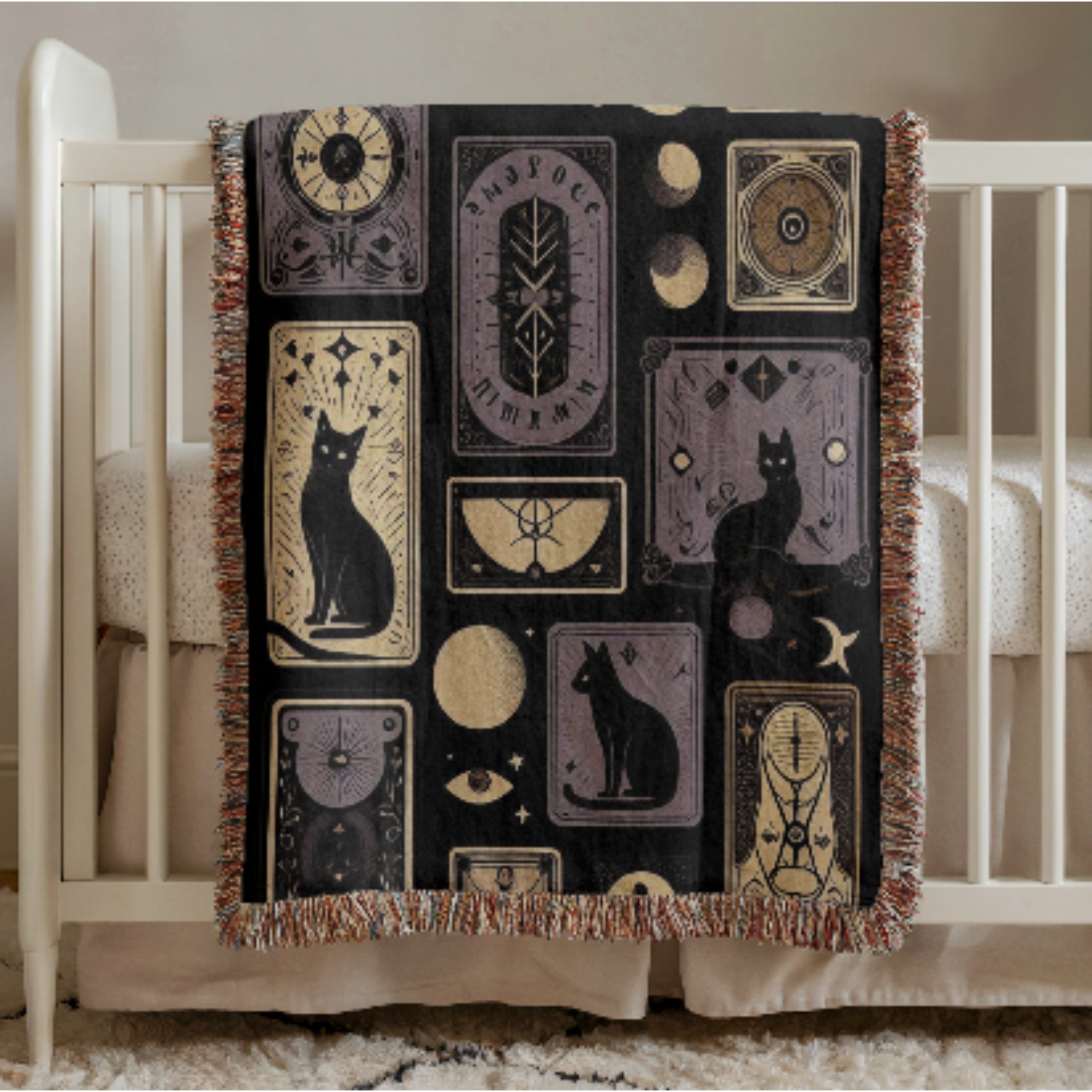 Black Cat Gothic Woven Baby Blanket with black cat and geometric patterns draped over a crib.