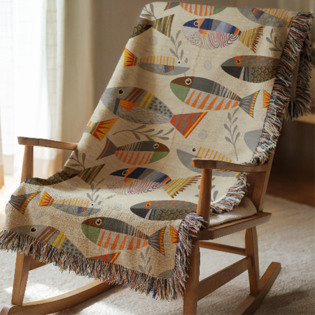 Rocking chair with a colorful fish-patterned throw blanket